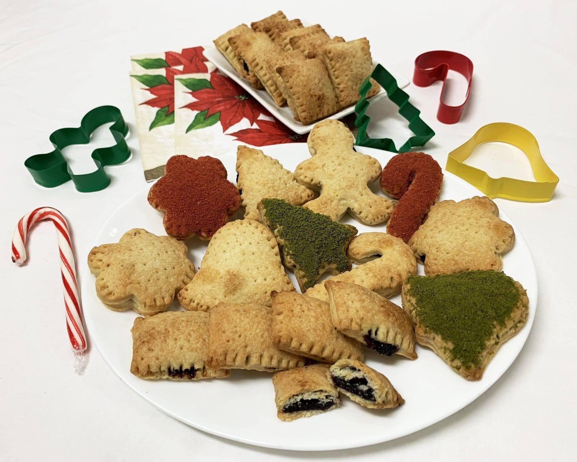 This is a picture of our Holiday Pastries filled with healthy Dark Berry Jam (Low sugar, extra tasty) on a white plate with a light background.