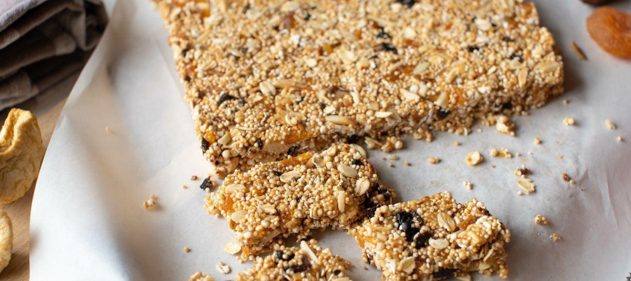 This is a picture of our Honey Cinnamon Quinoa Crunch cut in squares on a white napkin