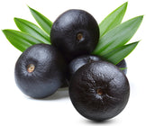 Image of multiple fresh acai berries and green leaves
