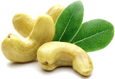 Image of 3 whole cashews and green leaves