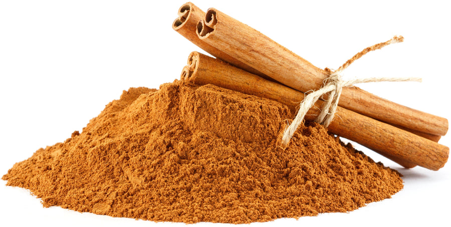 Image of a pile of ceylon cinnamon powder with 3 cinnamon sticks on top