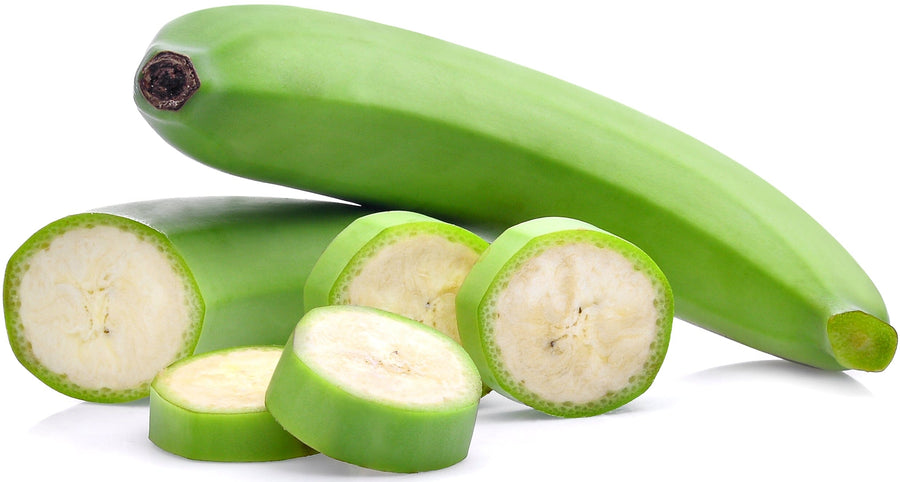Photo of whole green unripe banana with slices of unripe banana