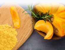 Photo of Pumpkin Powder and whole pumpkin with a couple slices on the side