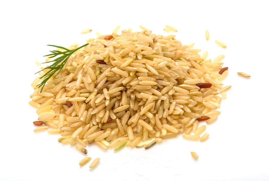Brown Rice piled together on white background