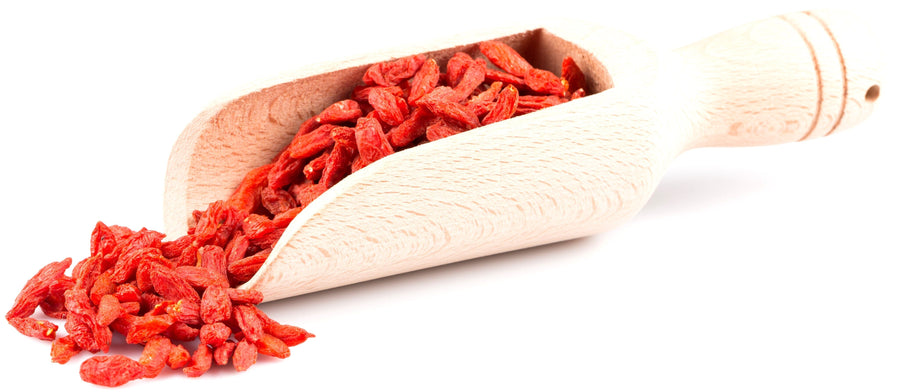 Image of Sun Dried Goji Berries - Organic in wooden serving spoon on white background.