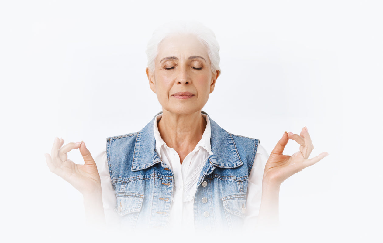 Image of older woman relaxing with eyes shut and breathing freely.
