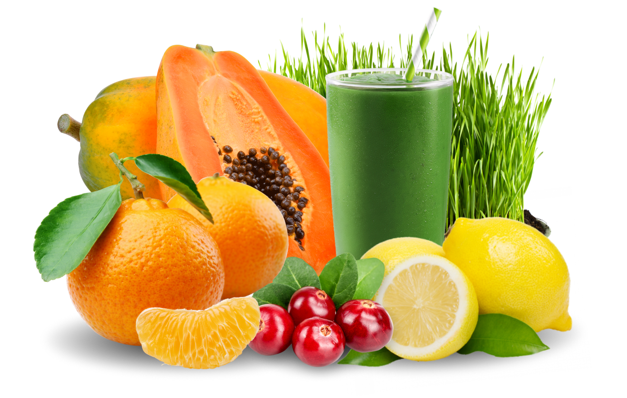 Image of smoothie amongst sliced mango, lemons, and wheatgrass.