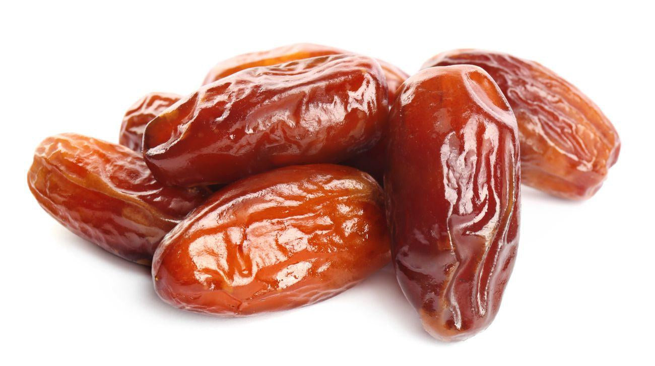 This is a picture of 5 Deglet Noor dates in a white background.