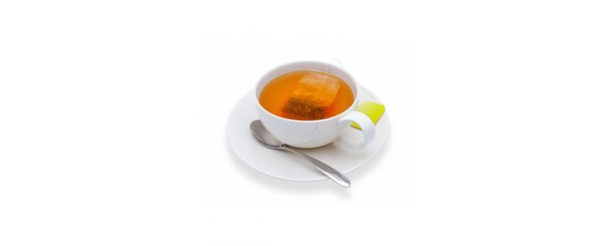 This is a picture of tea brewing in a white tea cup on a white saucer with a silver spoon, all on a white background.