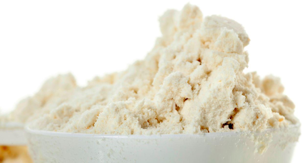 This is a picture of our New Vanilla Cream Whey Protein Isolate Powder in a white serving spoon