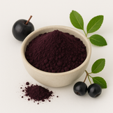 Image of Aronia berry powder in a white bowl with fresh aronia and leaves around it