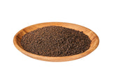 Image of brown bowl with Assam tea granules inside