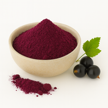 Bowl of organic black currant juice powder on a white background.
