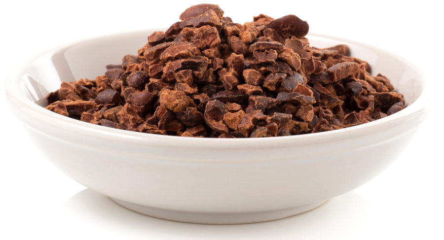 Sideview image of Cacao Nibs in a white bowl