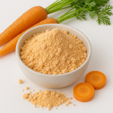 Image of carrot powder in a white bowl surrounded by fresh carrots