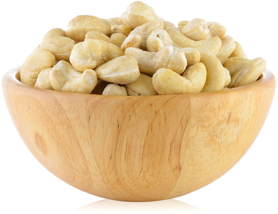 Image of whole cashews in a wooden bowl