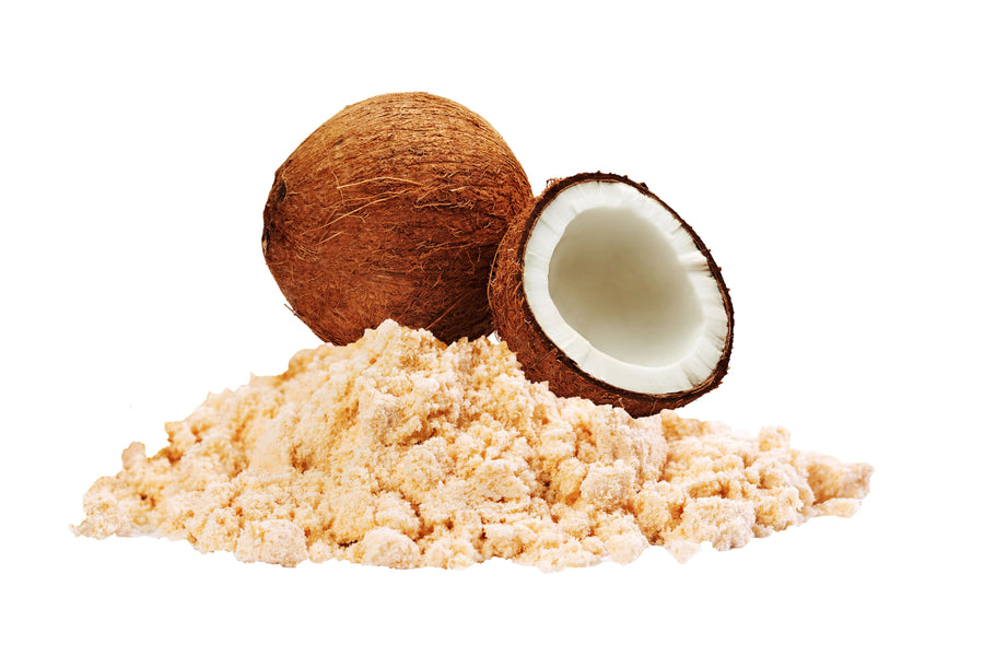 Image of brown Coconut Flour next to fresh coconuts