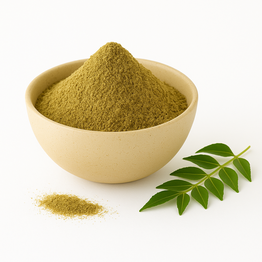 A beige ceramic bowl filled with organic curry leaf powder on a white background