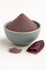 Organic dulse powder mounded in a plain neutral bowl on a white background, fine reddish-brown texture, evenly lit for true color.