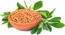 Image of Fenugreek Seeds in bowl surrounded by leaves on white background