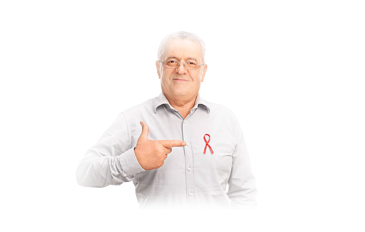 Older man pointing at ribbon on his chest signifying HIV
