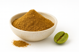 Green coffee bean extract powder mounded in a neutral bowl with a fine golden-brown texture on a white background