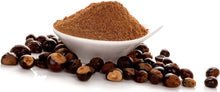 Image of a pile of Guarana Seeds and guarana seed powder in a white bowl