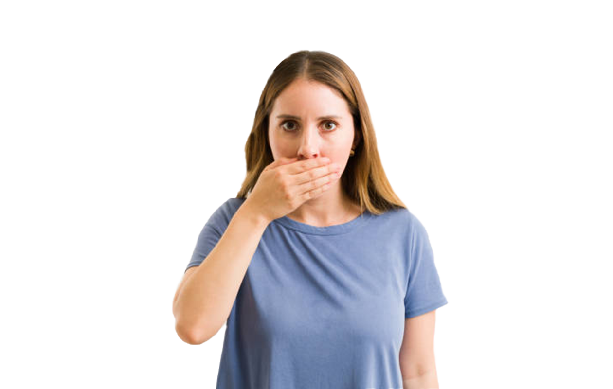 Woman holding hand over mouth because of Halitosis