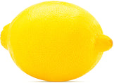 Image of halved lemon in front of whole Lemon with two green leaves on white background.