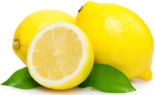 Image of halved Lemon with two whole lemons in the background