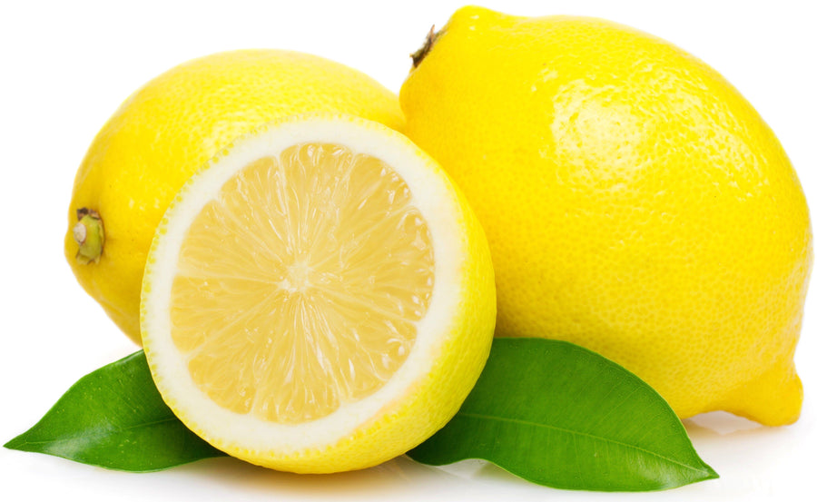 Image of halved Lemon with two whole lemons in the background