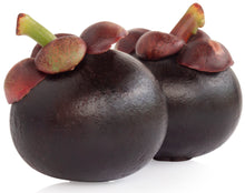 Close photo of 2 whole fresh raw purple Mangosteen Fruits