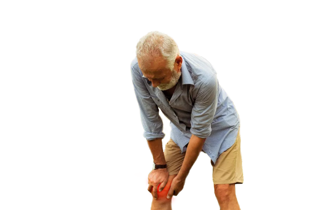 Image of older man in pain holding glowing red knee with hands illustrating joint pain.