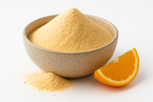organic orange juice powder in a speckled ceramic bowl