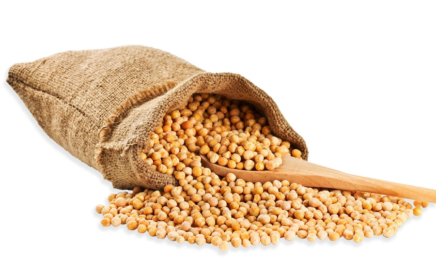 Image of a bag of golden peas and a wooden spoon