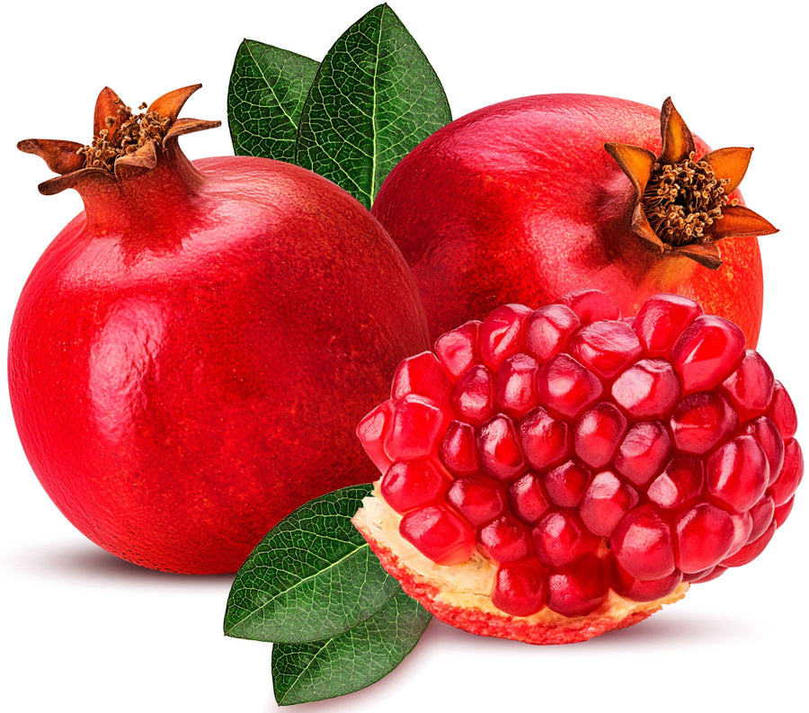 Image of a fresh Pomegranate and half of one showing its bright red seeds