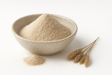 A bowl of light beige Organic Psyllium Husk Powder on a white background.