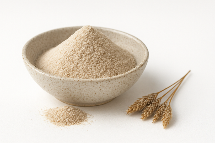 A bowl of light beige Organic Psyllium Husk Powder on a white background.