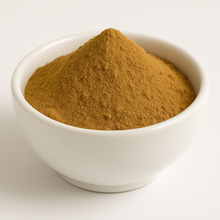 Orange brownish powder in a white bowl.