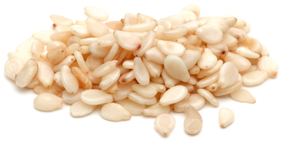 Closeup image of hulled Sesame Seeds on white background