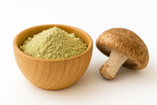 Beige powder in a wooden bowl with a shiitake mushroom next to the bowl