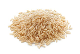 Brown Rice piled together on white background