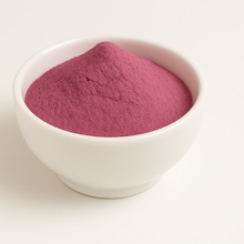 Faded red powder in a white bowl
