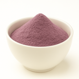 Purple color powder in a white bowl.