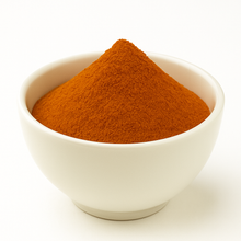 Red powder in a white bowl.