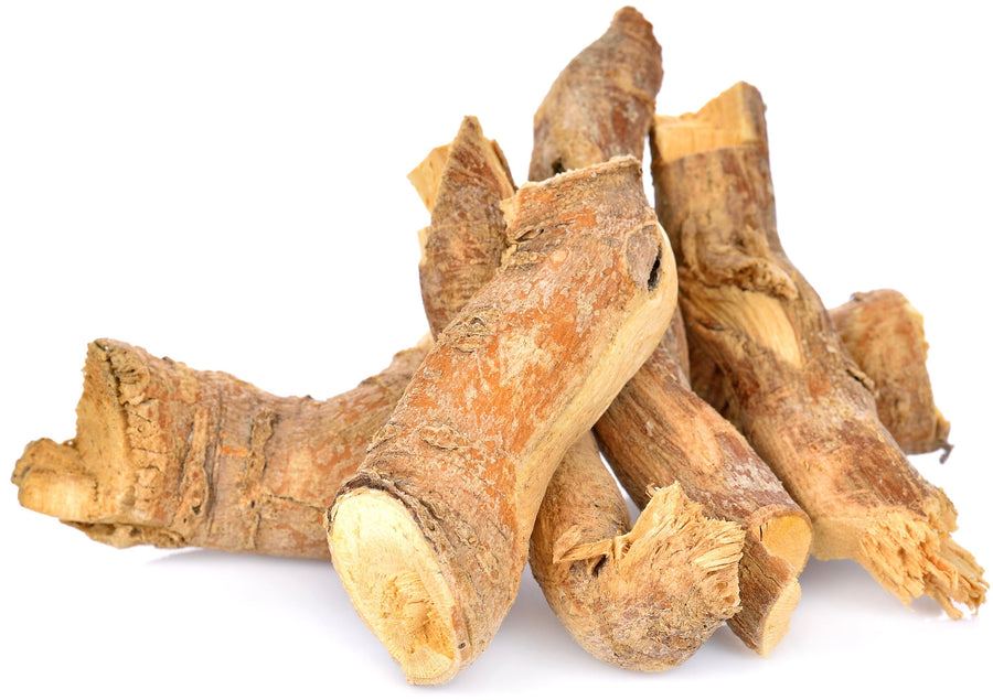 Tongkat Ali Roots laying on white background