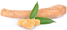 Tongkat Ali Root sliced with 2 green leave between longer root