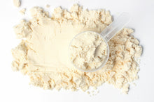 Whey Protein Isolate powder with scoop