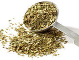 Image of green Yerba Mate Tea and a metal spoon