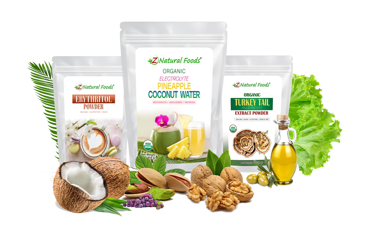 Three packages of Z Natural Foods products are displayed: Organic Erythritol Powder, Organic Electrolyte Pineapple Coconut Water, and Organic Turkey Tail Mushroom Extract Powder. The products are surrounded by fresh ingredients like coconuts, walnuts, pistachios, lettuce, and olive oil, representing the natural and organic nature of the products.